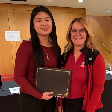 Sarah Grace Wiggins with Dr. Sheeler receiving the Outstanding Honors Contract Award.